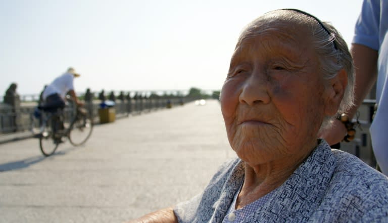 Yan Guiru, 95, sits in a wheelchair on the Marco Polo Bridge, or Lugouqiao, during an interview in west Beijing on July 3, 2015