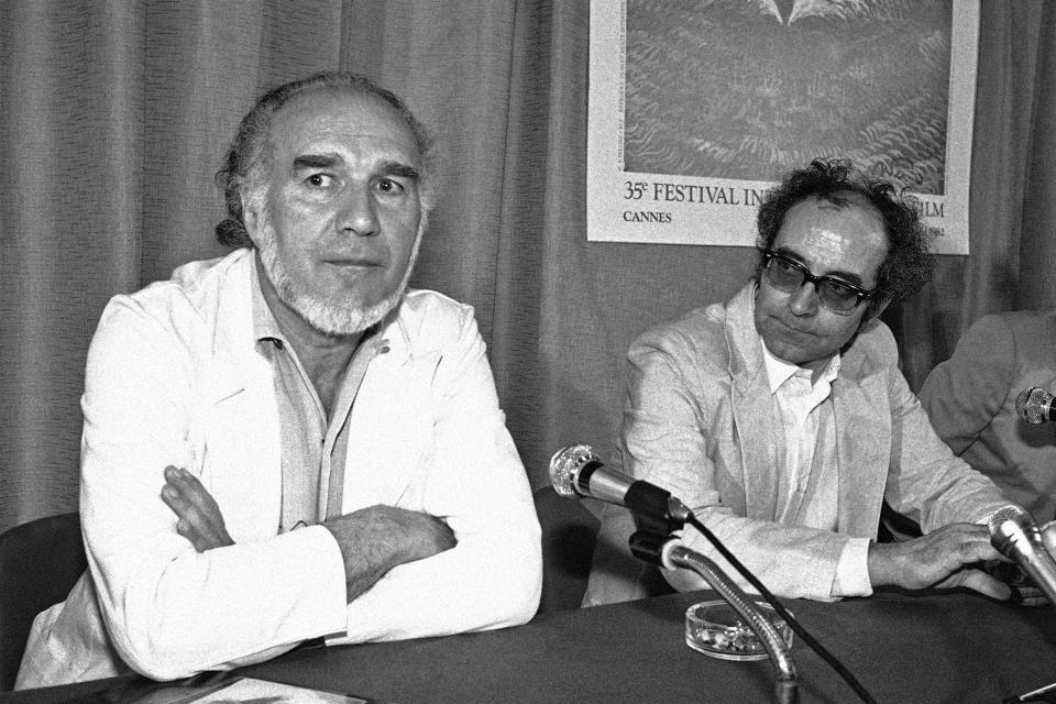 FILE - French actor Michel Piccoli, left, shown with French film director Jean-Luc Godard at the Cannes Film Festival, Cannes, France on May 24, 1982 . Director Jean-Luc Godard, an icon of French New Wave film who revolutionized popular 1960s cinema, has died, according to French media. He was 91. Born into a wealthy French-Swiss family on Dec. 3, 1930, in Paris, the ingenious "enfant terrible" stood for years as one of the world's most vital and provocative directors in Europe and beyond — beginning in 1960 with his debut feature "Breathless." (AP Photo/Jean-Jacques Levy, File)