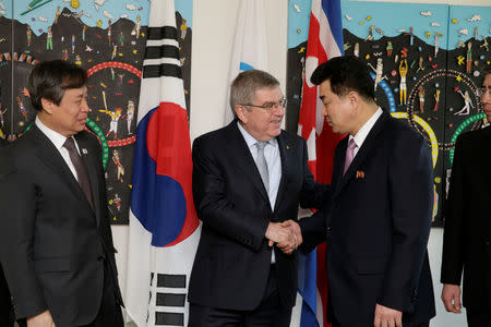 International Olympic Committee (IOC) President Thomas Bach from Germany welcomes North Korea's Olympic Committee President and Minister of Physical Culture and Sports Kim Il Guk and South Korean Sports Minister Do Jong-hwan, during a working meeting to discuss further sports cooperation between the Republic of Korea (ROK) and the Democratic People’s Republic of Korea (DPRK) as well as their bid to co-host the 2032 Summer Olympics, at the IOC Headquarters in Lausanne, Switzerland, February 15, 2019. Salvatore Di Nolfi/Pool via REUTERS