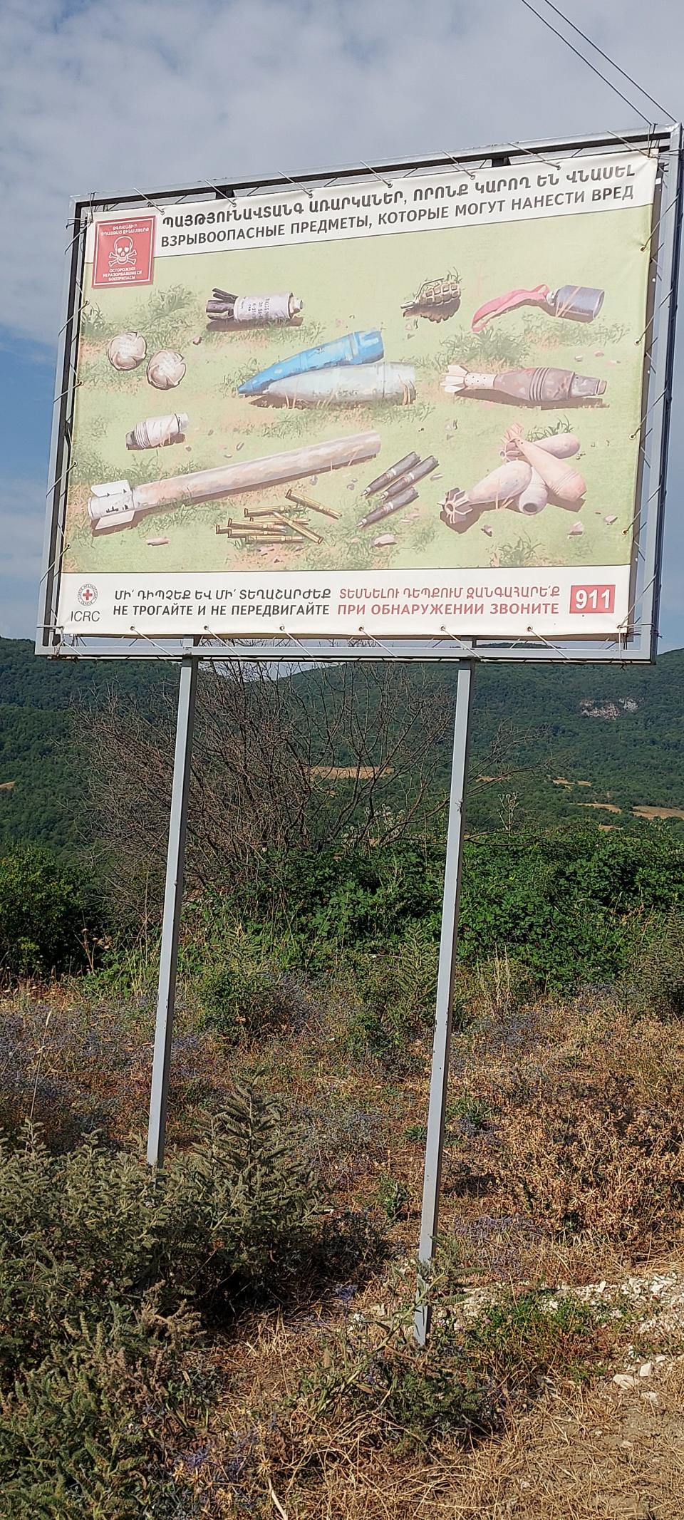 A road sign in Nagorno Karabagh warning the population of unexploded ordinance.