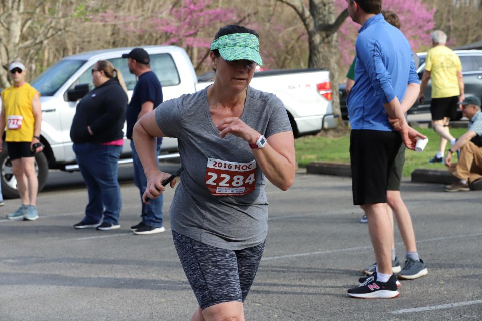 Tina Hall finishing the race as the first female .