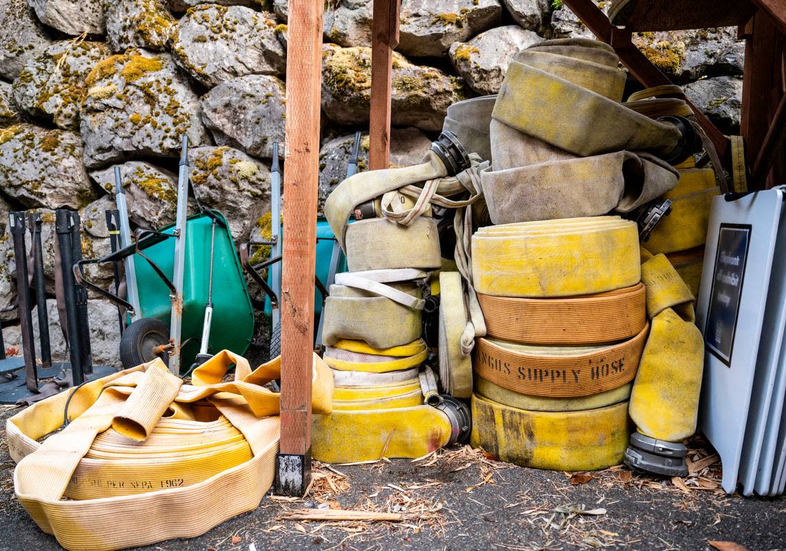 Old fire hoses that were donated to the Point Defiance Zoo and Aquarium by the Gig Harbor Fire Department are stored away until staff can turn them into enrichment devices for the animals at the zoo in Tacoma, Wash. on Oct. 3, 2022. The enrichment devices, such as braided browse feeders and hammocks, help challenge the animals and add variation to their daily lives.