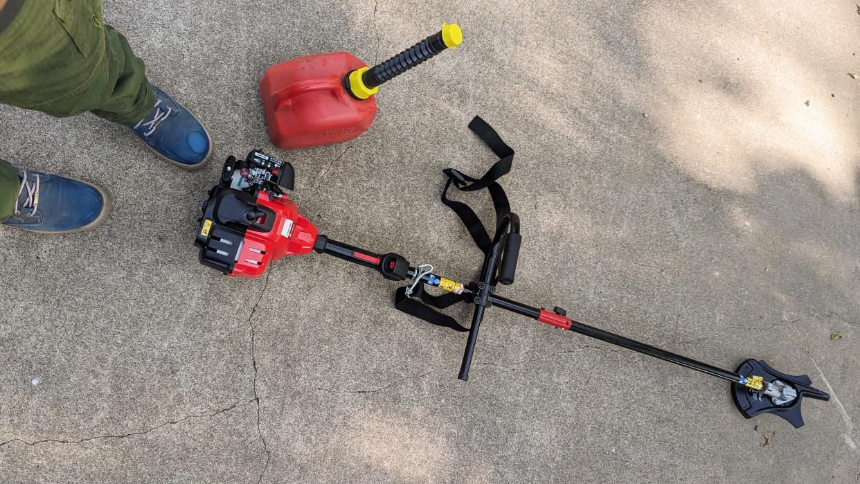  Troy-Bilt TB272BC XP Straight Shaft Brushcutter on ground beside tester's feet. 