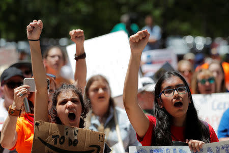 Gun control demonstrators protest outside of the annual National Rifle Association (NRA) convention in Dallas, Texas, U.S., May 5, 2018. REUTERS/Lucas Jackson