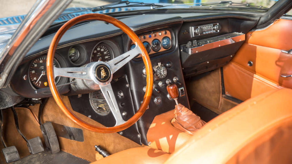 The tobacco-colored interior includes an odometer showing about 87,000 km (just over 54,000 miles). - Credit: Daniel Reinhard, courtesy of Bonhams.