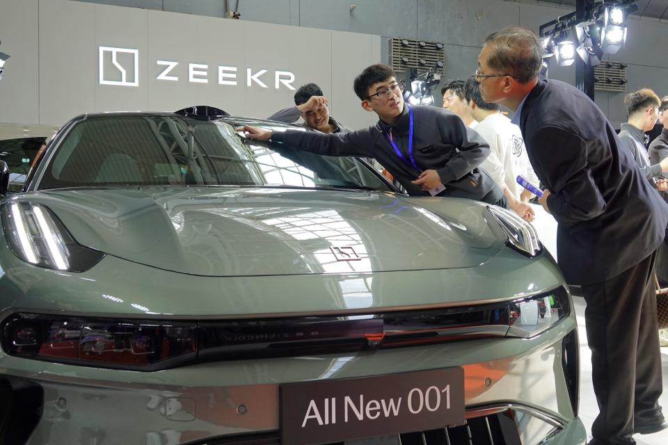 Visitors are learning about ZEEKR electric cars at the Spring Auto Show in Yantai, China, on April 14, 2024. (Photo by Costfoto/NurPhoto via Getty Images)