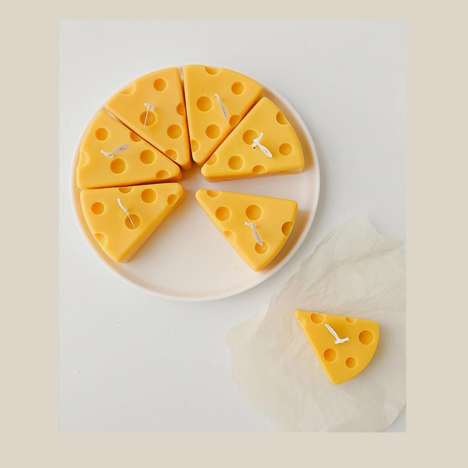 <p><a href="https://www.amazon.com/Decorative-Cheese-Scented-Candles-Kitchen/dp/B09GM5V8RL/ref=sr_1_7?crid=1BPTU1R4JR8CB&keywords=cheese+shaped+candle&qid=1698078579&sprefix=cheese+shaped+candle%2Caps%2C166&sr=8-7&tag=syn-yahoo-20&ascsubtag=%5Bartid%7C10054.g.12222340%5Bsrc%7Cyahoo-us" rel="nofollow noopener" target="_blank" data-ylk="slk:Shop Now;elm:context_link;itc:0;sec:content-canvas" class="link ">Shop Now</a></p><p>Cheese Shaped Candles, 5-Piece</p><p>$11.03</p>