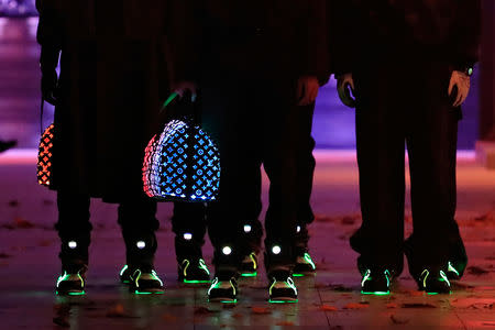 Models present creations by designer Virgil Abloh as part of his Fall/Winter 2019-2020 collection show for fashion house Louis Vuitton during Men's Fashion Week in Paris, France, January 17, 2019. REUTERS/Gonzalo Fuentes