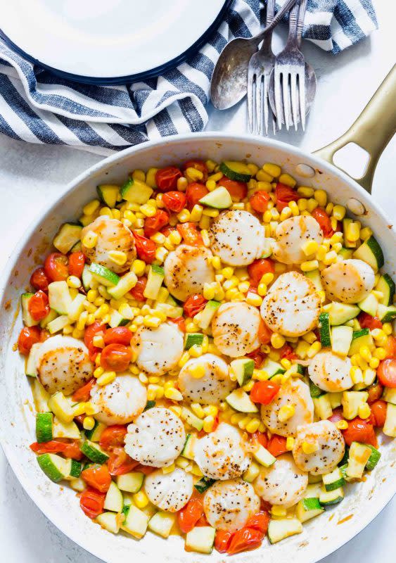 <p>Table for Two</p><p>Scallops and summer vegetables are the perfect combinations for a light and quick weeknight meal!</p><p><strong>Get the recipe: <a href="https://www.tablefortwoblog.com/scallops-and-summer-vegetable-skillet/" rel="nofollow noopener" target="_blank" data-ylk="slk:Scallops and Summer Vegetable Skillet;elm:context_link;itc:0;sec:content-canvas" class="link ">Scallops and Summer Vegetable Skillet</a></strong></p>