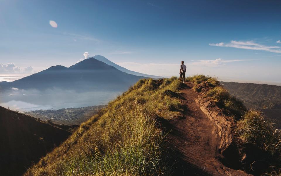 Hiker on top of Mount Batur - Getty/Moment RF