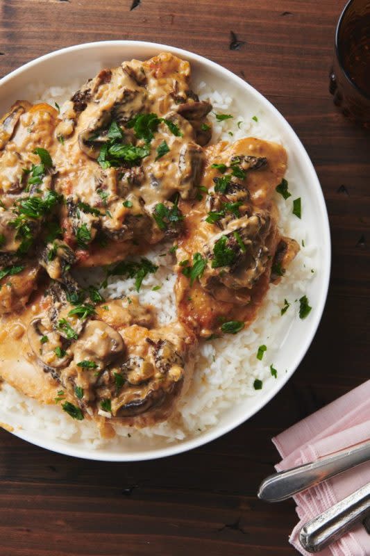 <p>Katie Workman</p><p>This chicken dish is simple, lush and total comfort food at its best. Even better: dinner in 30 minutes!</p><p><strong>Get the recipe: <a href="https://themom100.com/recipe/parmesan-garlic-mushroom-chicken/" rel="nofollow noopener" target="_blank" data-ylk="slk:Parmesan Garlic Mushroom Chicken;elm:context_link;itc:0;sec:content-canvas" class="link rapid-noclick-resp">Parmesan Garlic Mushroom Chicken</a></strong></p>
