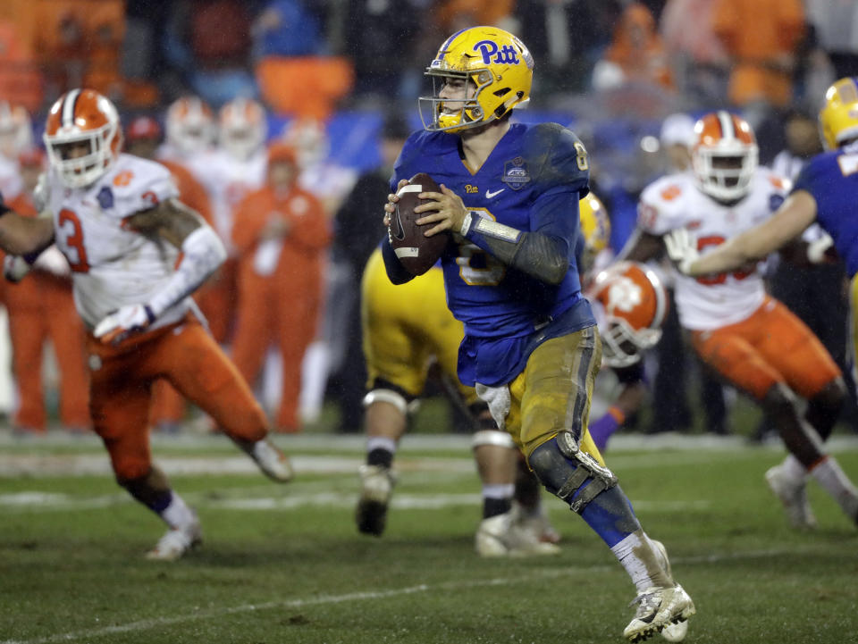 Pittsburgh's Kenny Pickett (8) rolls out to pass against Clemson in the first half of the Atlantic Coast Conference championship NCAA college football game in Charlotte, N.C., Saturday, Dec. 1, 2018. (AP Photo/Chuck Burton)