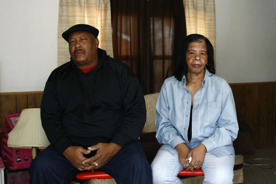 FILE - Antone Black, left, and his wife, Jennell, parents of Anton Black, 19, who died after a struggle with three officers and a civilian outside the home in September 2018, pose for a photograph in their home, Jan. 28, 2019, in Greensboro, Md. A federal judge on Tuesday, Jan. 19, 2022, has refused to throw out a lawsuit’s claims that police on Maryland’s Eastern Shore used excessive force on Anton Black, a 19-year-old Black man who died in 2018 during a struggle with officers who handcuffed him and shackled his legs. (AP Photo/Patrick Semansky, File)