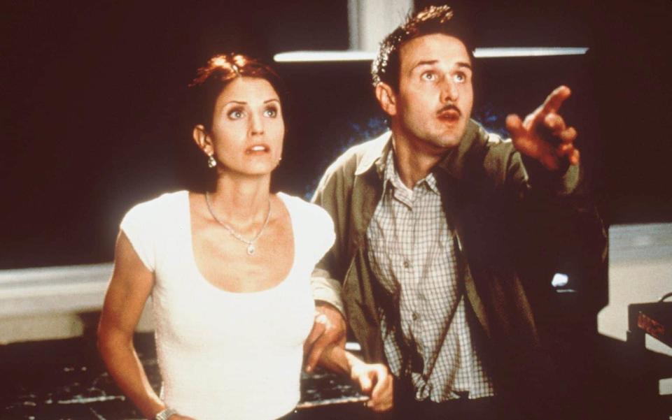 Courteney Cox and David Arquette in Scream 2; Arquette has appeared in every instalment - Film Stills