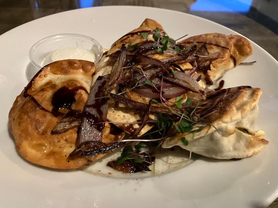 35º Brix's roasted vegetable pierogis are stuffed with root vegetables served with caramelized onions, brown butter and a demi-glace.