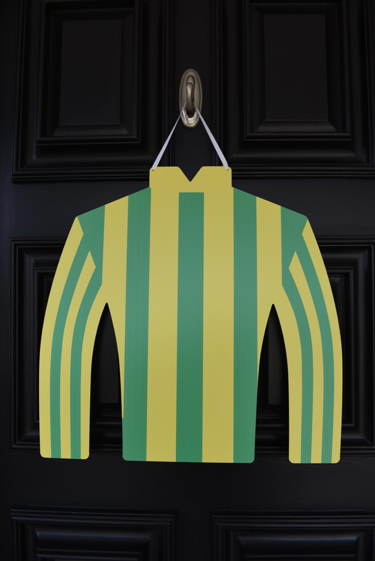 Welcome your Kentucky Derby Day guests with a decoration on your front door.  Bright and colorful jockey silks make a festive door decoration.