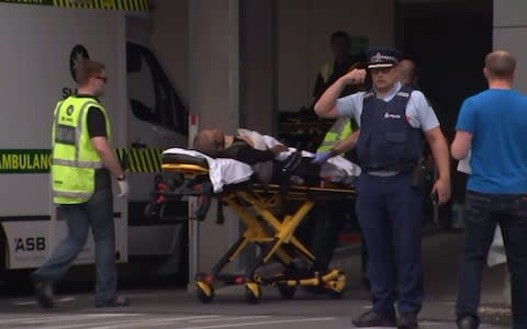 Victim arriving at hospital in Christchurch following the shootings - Credit: AFP