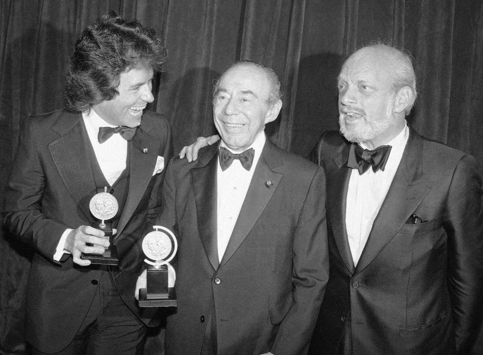 FILE - In this June 4, 1979 file photo, Jack Hofsiss, left, and Hal Prince, right, flank Richard Rodgers at the Tony Award presentations in New York. Prince, who pushed the boundaries of musical theater with such groundbreaking shows as “The Phantom of the Oepra,” "Cabaret," "Company" and "Sweeney Todd" and won a staggering 21 Tony Awards, died Wednesday, July 31, 2019, after a brief illness in Reykjavik, Iceland. He was 91. (AP Photo/Richard Drew, File)