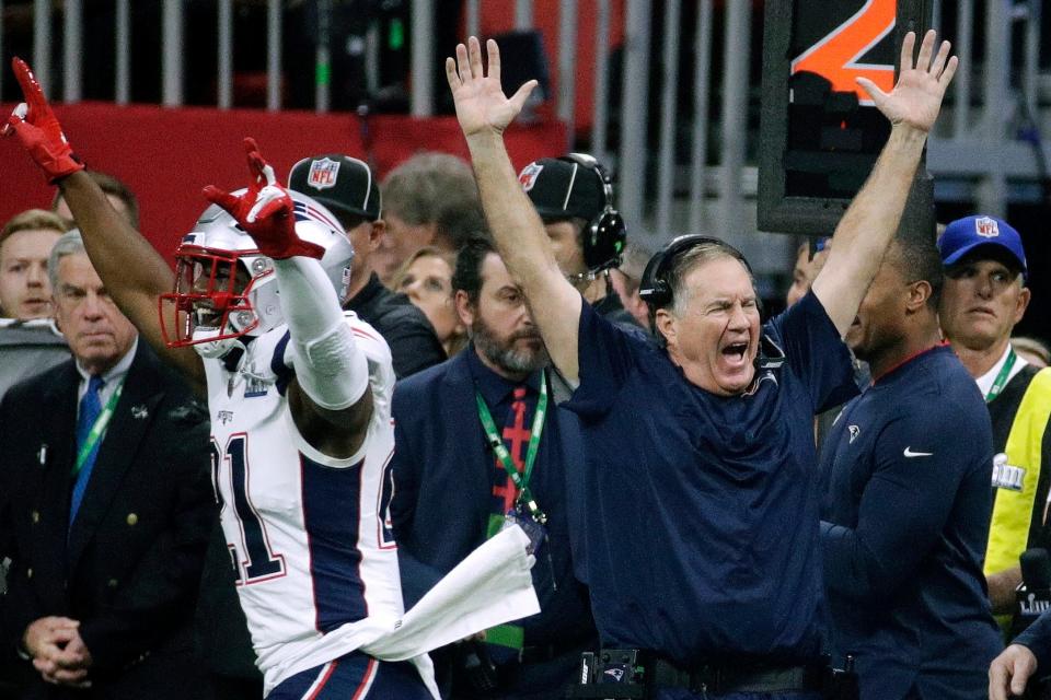 New England's Duron Harmon (21) and head coach Bill Belichick celebrate after Super Bowl LIII against the Los Angeles Rams in Atlanta on Feb. 3, 2019.