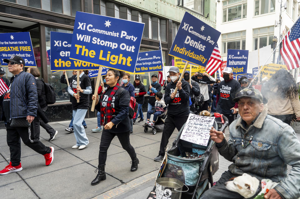 Protesters against Chinese President Xi Jinping march near the APEC (Asia-Pacific Economic Cooperation) summit on Thursday, Nov. 16, 2023, in San Francisco. (AP Photo/Noah Berger)