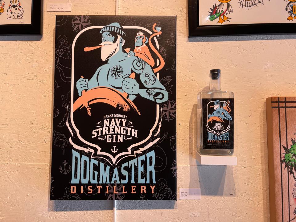 Sawyer Wade's design for a gin from Columbia's DogMaster Distillery hangs in a 2022 Orr Street Studios exhibit.