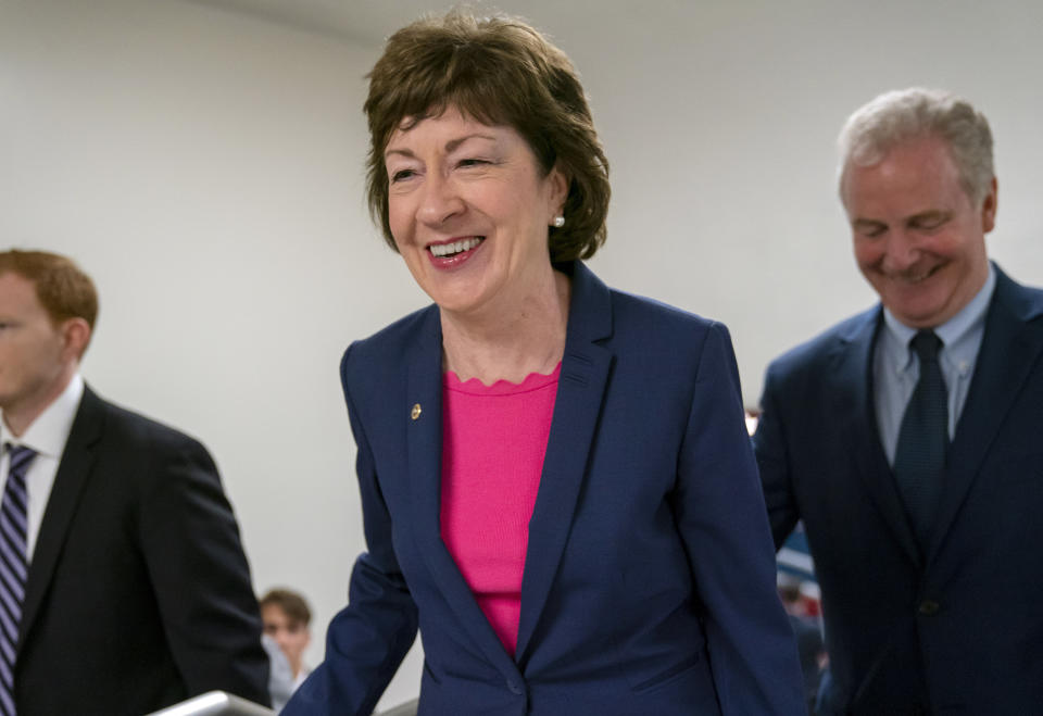 FILE - In this June 18, 2019 file photo, Sen. Susan Collins, R-Maine, center, arrives at the Capitol in Washington to extend her perfect Senate voting record to 7,000. National money is already flowing into Maine’s 2020 Senate race, offering the latest indicator that incumbent Collins faces a stiff reelection fight. Maine House Speaker Sara Gideon, D-Freeport, is challenging Collins in the 2020 election. (AP Photo/J. Scott Applewhite, File)