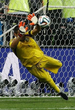 Argentina's goalkeeper Sergio Romero saves the match deciding penalty in their 2014 World Cup semi-finals against Netherlands at the Corinthians arena in Sao Paulo July 9, 2014. REUTERS/Darren Staples