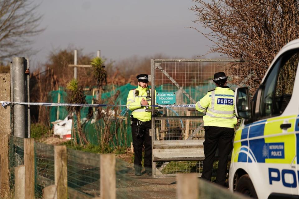 Police officers put up crime scene tape at set of allotments, at the north of Shenfield Way, near to the scene in Brighton, East Sussex, where remains have been found in the search for the baby of Constance Marten and Mark Gordon. The pair were arrested on suspicion of gross negligence manslaughter after being stopped without the baby in Brighton on Monday following several weeks of avoiding the police. Picture date: Thursday March 2, 2023. (PA Wire)
