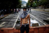 Opposition supporters block an avenue during a rally against Venezuela's President Nicolas Maduro's government in Caracas, Venezuela, July 28, 2017. REUTERS/Andres Martinez Casares