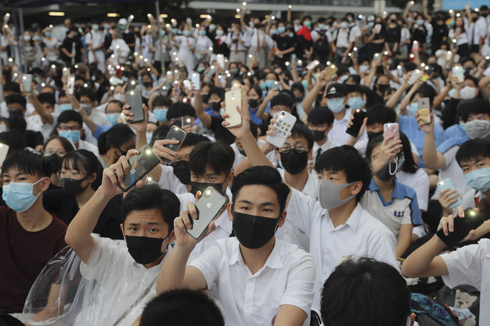 Secondary students hold up their smartphone lights on during a protest in Hong Kong, on Monday, Sept. 2, 2019. Hong Kong has been the scene of tense anti-government protests for nearly three months. The demonstrations began in response to a proposed extradition law and have expanded to include other grievances and demands for democracy in the semiautonomous Chinese territory. (AP Photo/Kin Cheung)