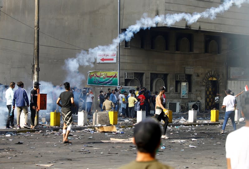 Demonstrators take part in the ongoing anti-government protests in Baghdad