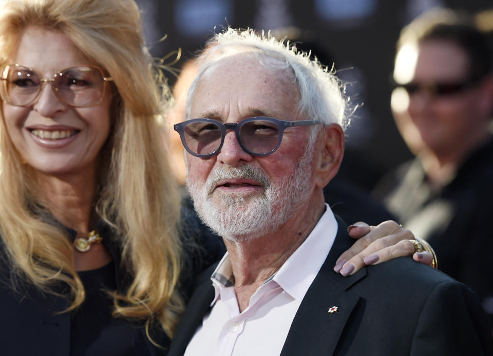 FILE - Norman Jewison, center, director of the 1967 film "In the Heat of the Night," appears with his wife Lynne St. David before a 50th anniversary screening of the film at the 2017 TCM Classic Film Festival in Los Angeles on April 6, 2017. Jewison, a three-time Oscar nominee who in 1999 received an Academy Award for lifetime achievement, died “peacefully” Saturday, Jan. 20, 2024, according to publicist Jeff Sanderson. He was 97. (Photo by Chris Pizzello/Invision/AP, File)