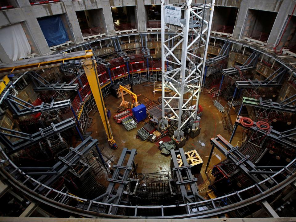 A large circular metal structure under construction at ITER in France