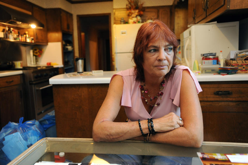 Nigerian scam victim Betsy Shyrock poses for portrait at her home in Conyers, Georgia, September 6, 2009. Shyrock was taken for $10,000 by a man she met on an online dating website where he romanced her and then dumped her when her money ran out.  (Photo by Erik S. Lesser/Chicago Tribune/MCT via Getty Images)