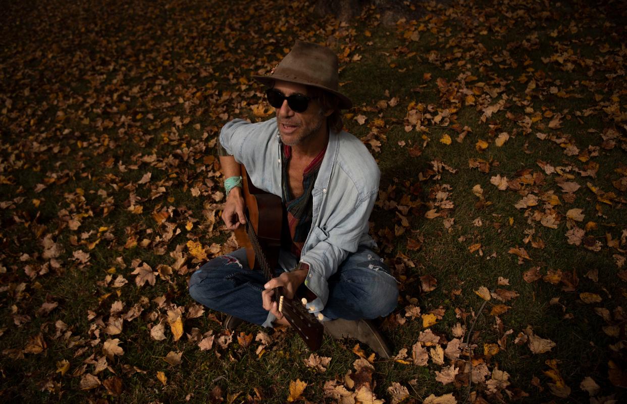 Todd Snider plays the guitar at his home in Nashville, Tenn., Tuesday, Oct. 24, 2023.