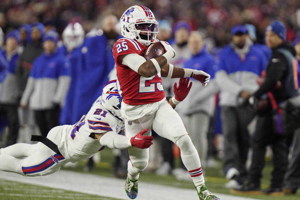 New England Patriots' Marcus Jones (25) breaks free from Buffalo Bills safety Jordan Poyer (21) on his touchdown run during the first half of an NFL football game, Thursday, Dec. 1, 2022, in Foxborough, Mass. (AP Photo/Steven Senne)