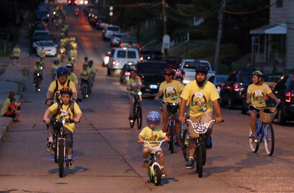 Tour de Belleville bicyclists have included people of all ages and backgrounds and bikes of all shapes and sizes. Here, a family with young children is shown participating in the 2014 ride.
