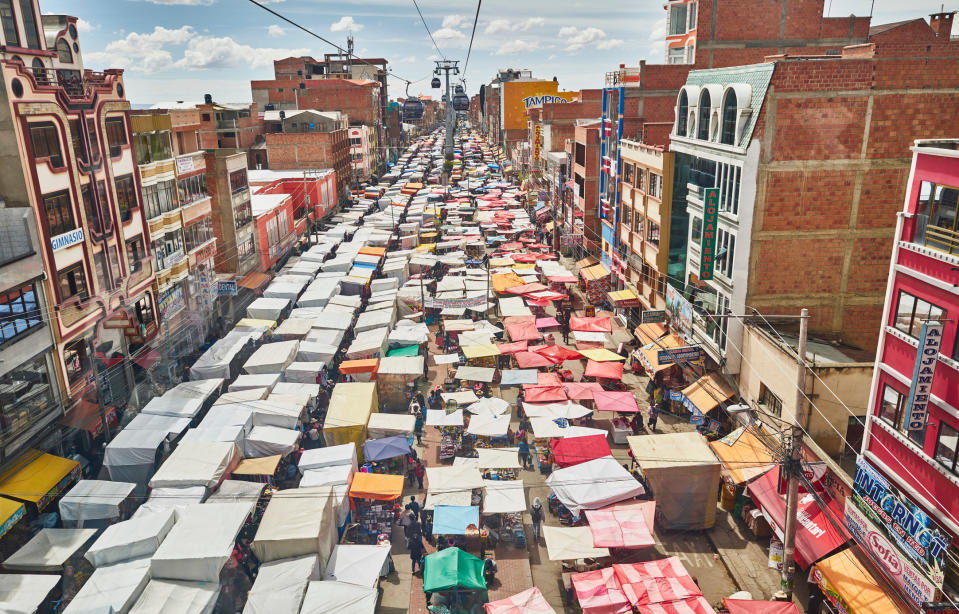 A gondola over a street market in La Paz