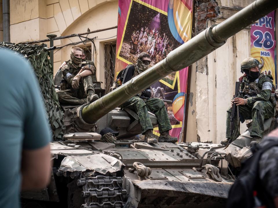 Members of Wagner group sit atop of a tank in a street in the city of Rostov-on-Don, on June 24, 2023.