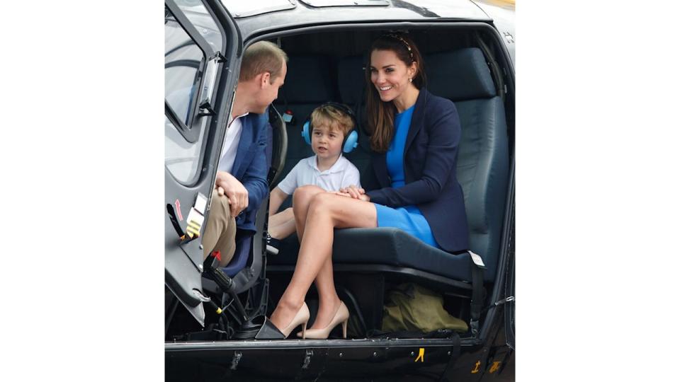 Prince George sitting in a helicopter with William and Kate in 2016