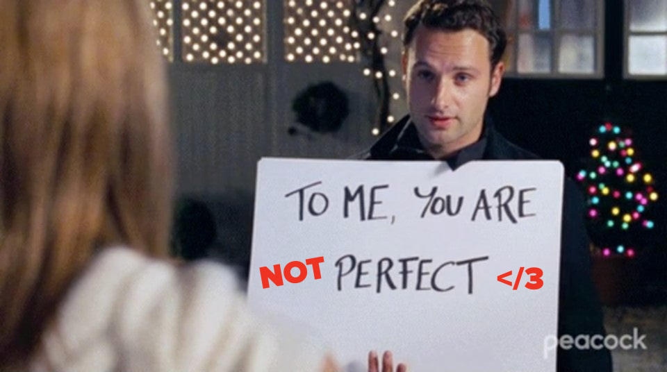 guy holding a sign that's been edited to say to me you are not perfect