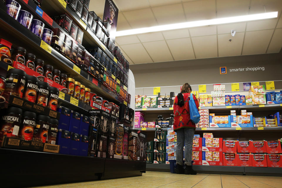 Woman browses in Australian Aldi coffee aisle as Lazzio sales spike 50% saving Nomad Coffee supplier