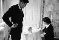 <p>Then U.S. Senator John F. Kennedy with his wife Jacqueline and their baby daughter, Caroline, in their Georgetown home. Caroline was born November 27, 1957.</p>