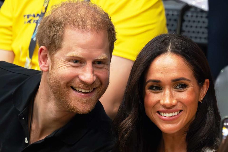 <p>Samir Hussein/WireImage</p> Prince Harry and Meghan Markle at the Invictus Games in Germany on Sept. 13, 2023