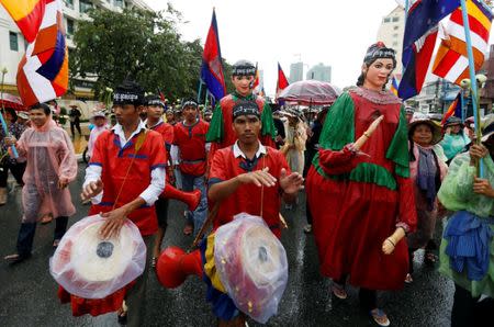 People take part in a rally marking World Habitat Day, to appeal to the Cambodian government to stop evicting people from their homes, according to rally organisers, in central Phnom Penh October 10, 2016. REUTERS/Samrang Pring