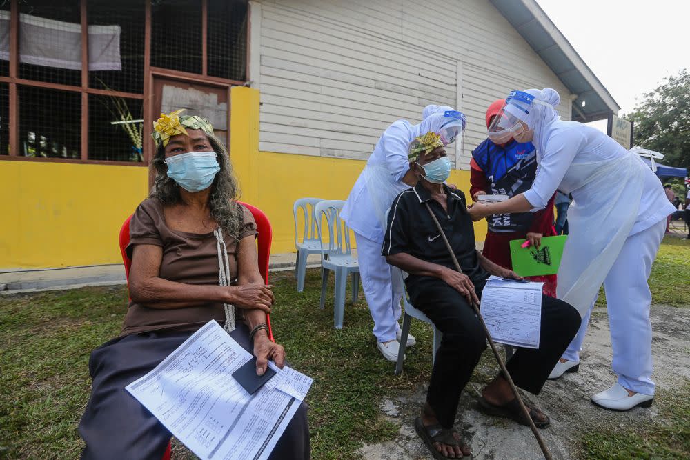 Orang Asli receive their Covid-19 jab in Jenjarom July 29, 2021. — Picture by Yusof Mat Isa