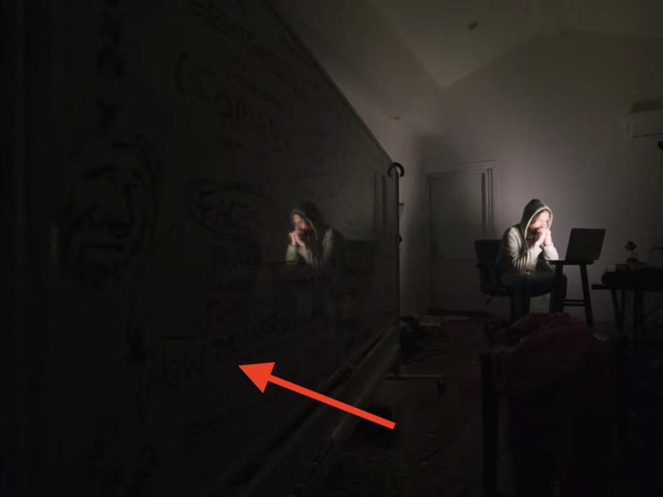 A red arrow points to the whiteboard next to Bo Burnham.