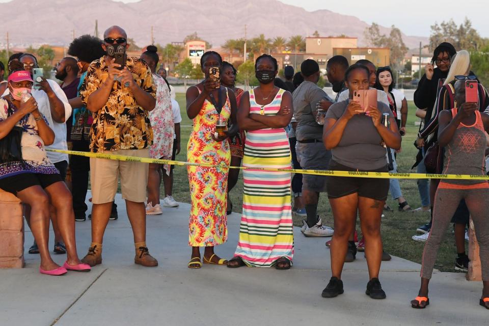 People look on during a Juneteenth Reunion Family Caravan and BBQ at Craig Ranch Regional Park put on by the National Juneteenth Observance Foundation on June 19, 2020 in North Las Vegas, Nevada.