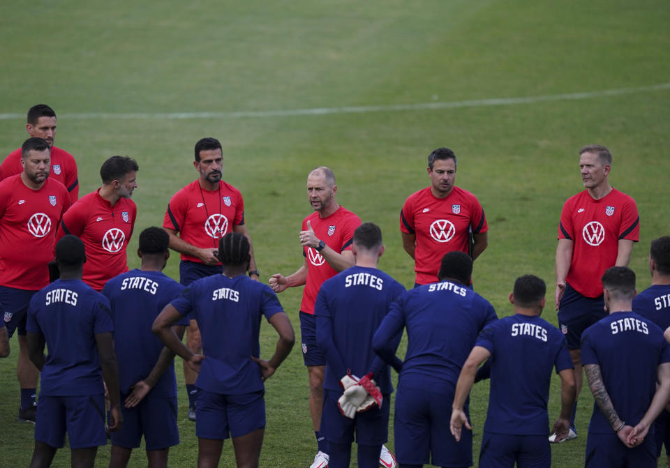 United States head coach Gregg Berhalter, top center, speaks with his players prior a training session ahead of the World Cup 2022 qualifying soccer match against Jamaica in Kingston, Monday, Nov. 15, 2021. (AP Photo/Fernando Llano)