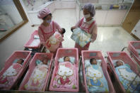 FILE - In this Jan. 20, 2009 file photo, nurses check on newborns, at the Hello Kitty-designed maternity ward, at the Hau Sheng hospital in the southern Taiwan city of Chunghua. Five years after the deepest global recession since the 1930s sent birth rates plunging around the world, many couples are still not having children. That’s good news if you’re worried about an overcrowded planet. But it’s bad for the economy. (AP Photo/Wally Santana, File)